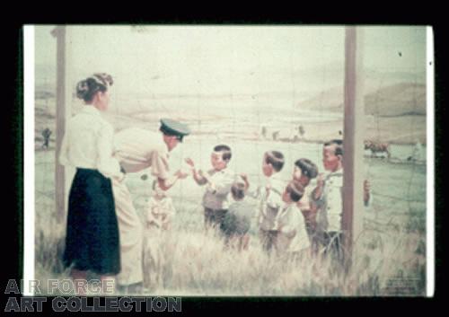 COMMANDER OF K-14 AIR BASE ADMINISTERING MEDICAL AID TO KOREAN CHILDREN